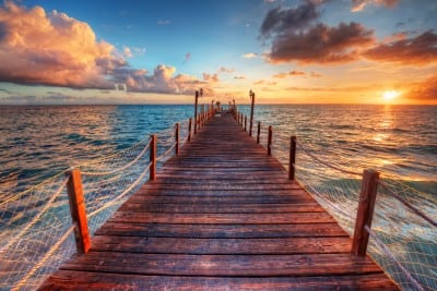 ‘Evening sunset’ depicting the tautology Sunset over a pier